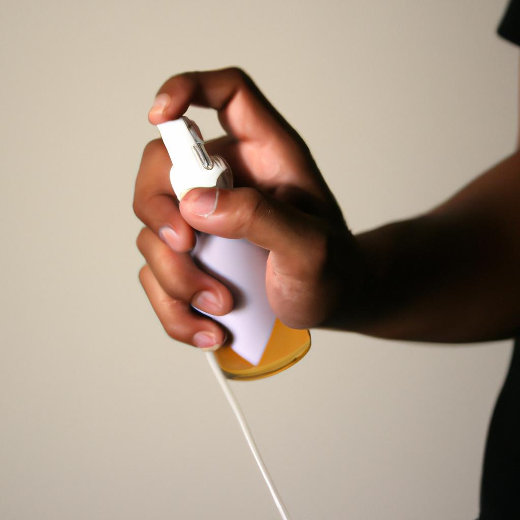 Person using disinfectant spray