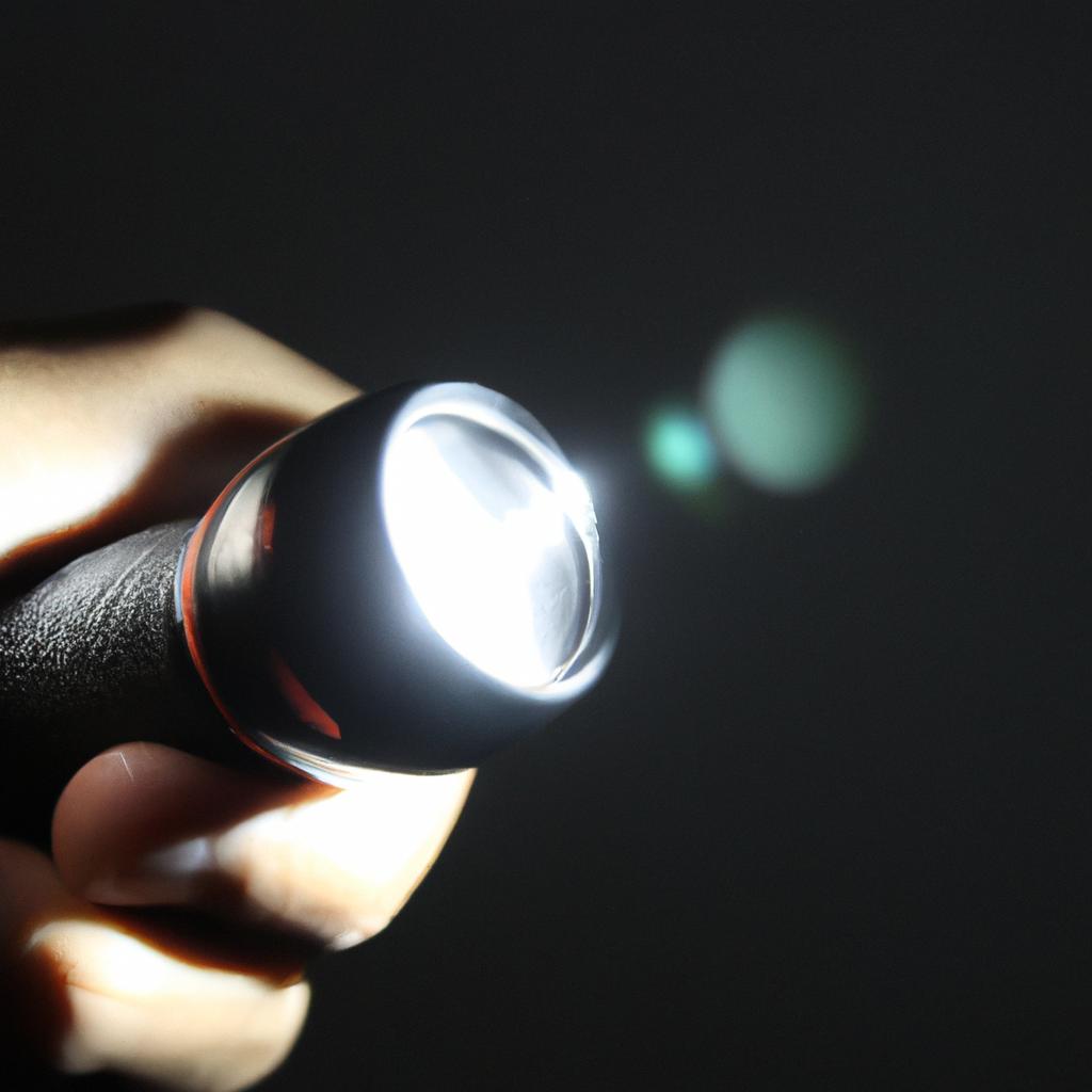 Person holding flashlight in hand